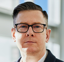 ภาพเหมือนของ CEO Alexander Hughes ผู้บริหารของบริษัทซื้อขายคริปโต